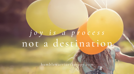 a joyful walk in nature with balloons to representing the Buddhist Psychotherapy concept of finding your joy. with the overlay of words saying: "joy is a process not a destination